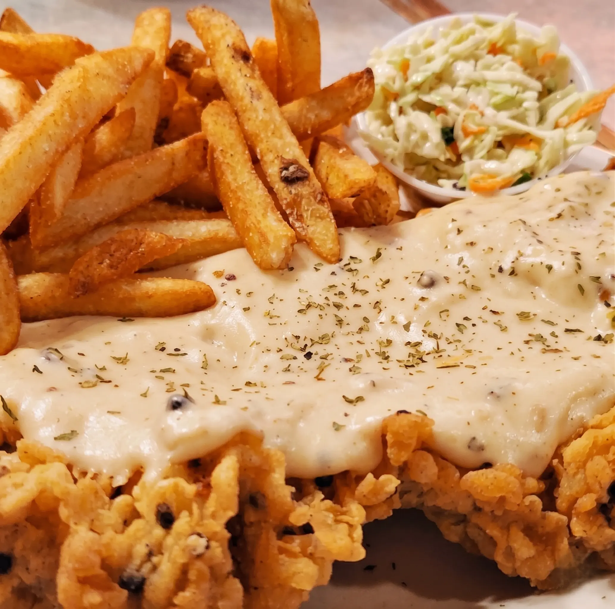Chicken Fried Steak with country gravy, fries and coleslaw at Big Guy's Ranch & Saloon, Winnipeg