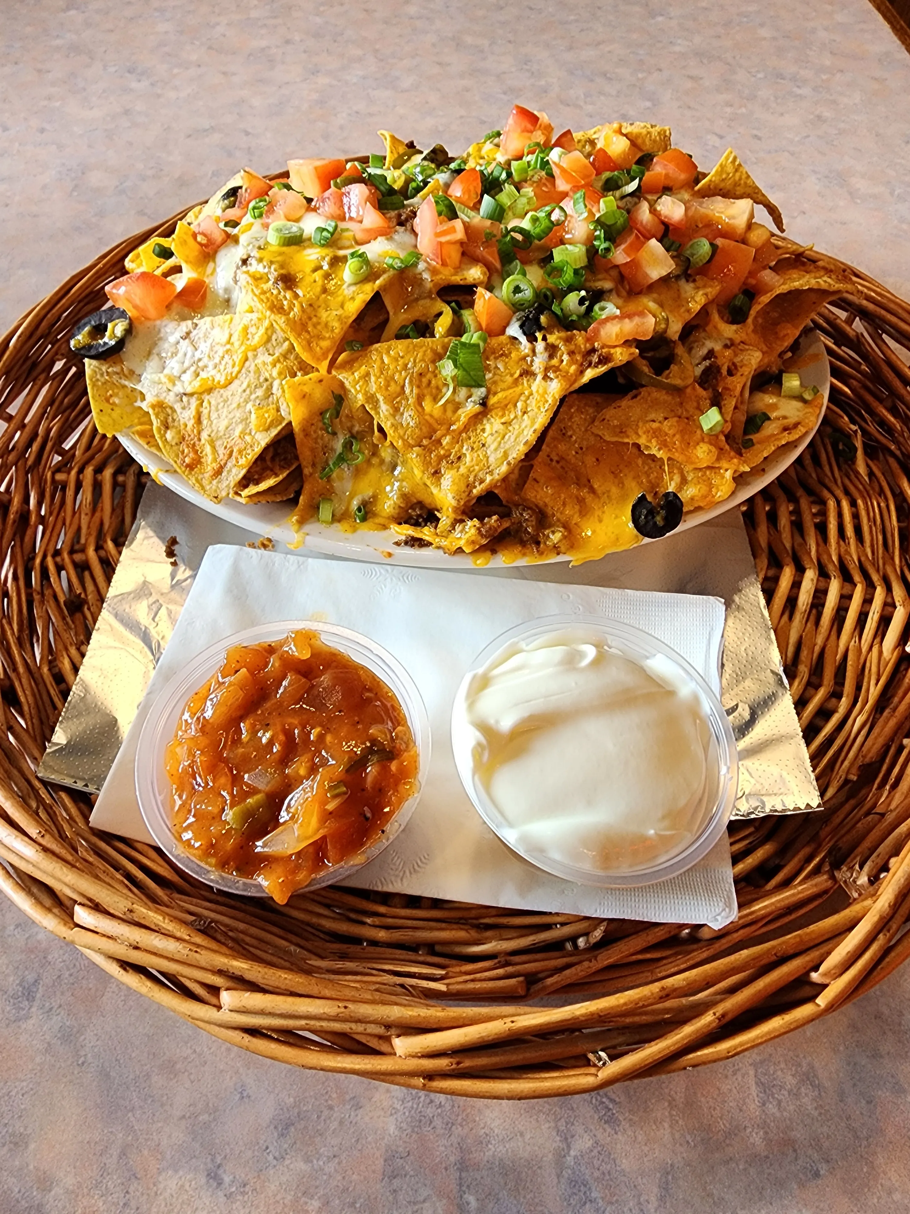 Nachos Grande — corn tortillas loaded with seasoned beef, cheddar, jalapenos, olives and green onion at Big Guy's Ranch & Saloon, Meadowood, Winnipeg